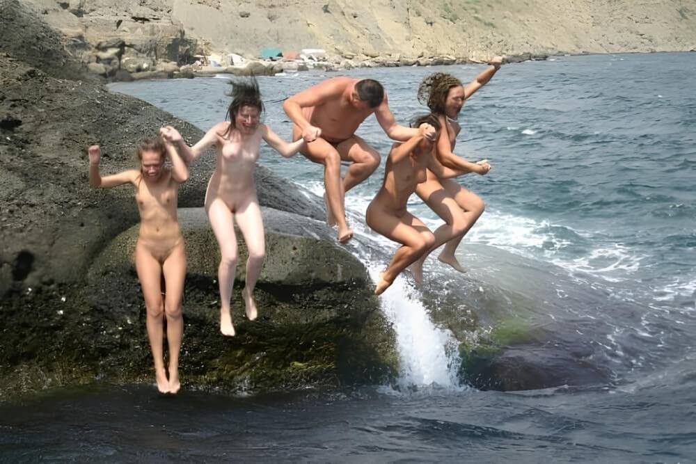 Mens and girls nudists on a beach - Naturism teaches respect for nature