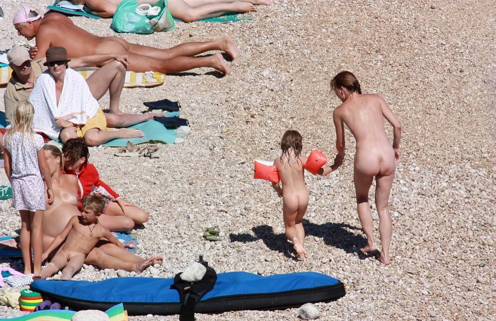 Orange Floaty Safety First Naturist pics - Nudism teaches respect for the body and nature